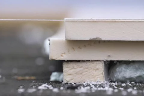 Roofing insulation, installation of insulation sheets on foam Stock Photos