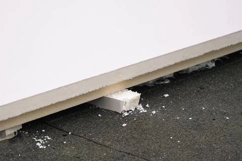 Roofing insulation, installation of insulation sheets on foam Stock Photos