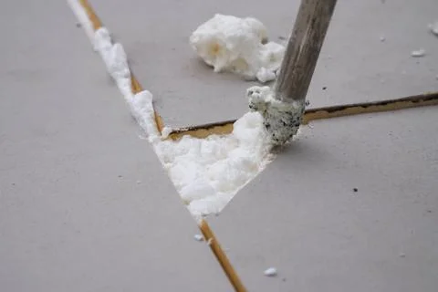 Roofing insulation, installation of insulation sheets on foam Stock Photos