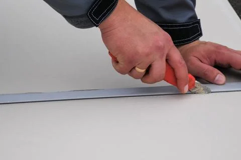 Roofing insulation, installation of insulation sheets on foam Stock Photos