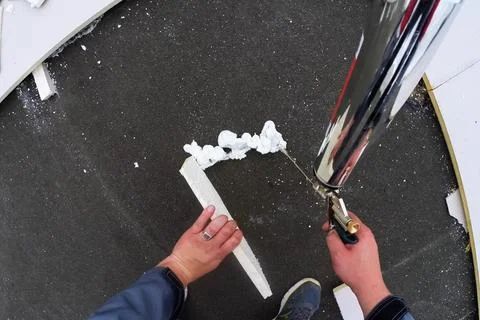 Roofing insulation, installation of insulation sheets on foam Stock Photos