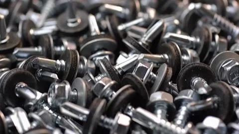 Roofing screws are lying on the table close-up. Smooth passage of the slider  Stock Footage 186788699
