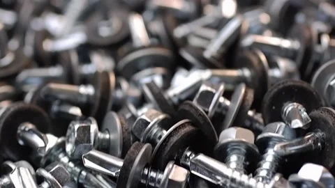 Roofing screws are lying on the table close-up. Smooth passage of the slider  Stock Footage 186788700