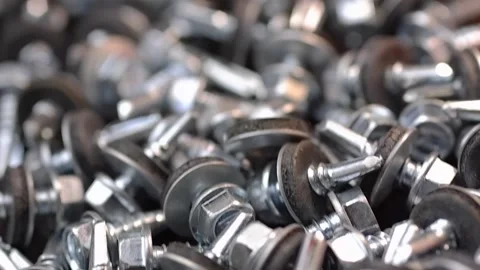Roofing screws are lying on the table close-up. Smooth passage of the slider  Stock Footage 186788706