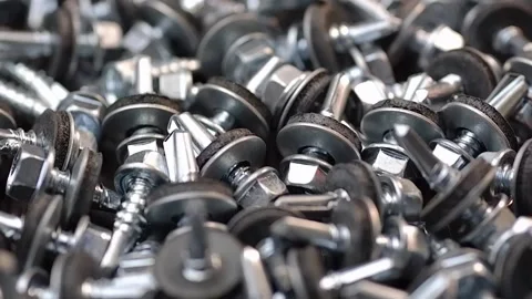 Roofing screws are lying on the table close-up. Smooth passage of the slider  Stock Footage 186789822