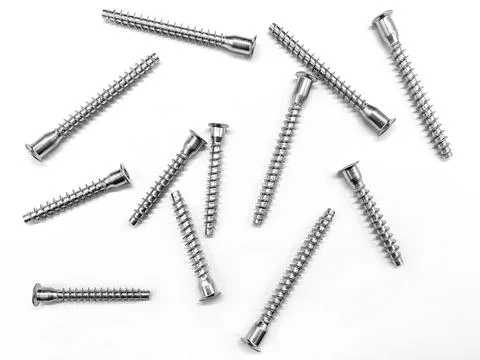 Roofing screws on a white background. Chrome plated screws. Stock Photos