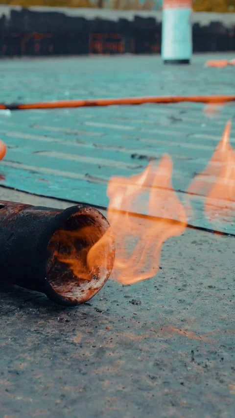 Roofing torch creating a layer of waterproofing material Stock Footage 316760078