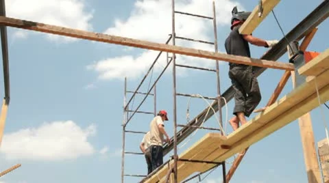 Roofing works - builders on scaffolds Stock Footage
