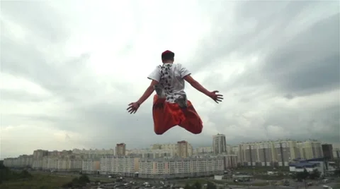 Roofrunner Jumping From The Roof Stock Footage 62019793
