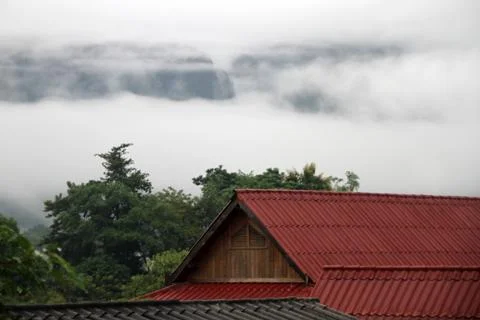 Roofs and clouds Stock Photos