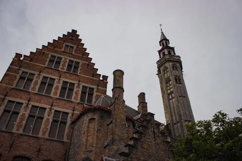 Roofs And Windows Of Old Authentic Brick Houses And Church In Bruges, Belgium Stock Photos