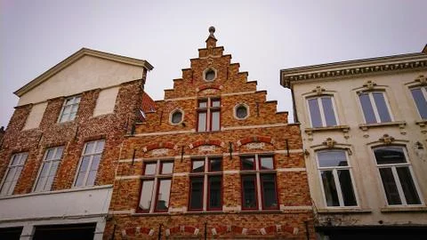 Roofs And Windows Of Old Authentic Brick Houses In Bruges, Belgium Foto stock