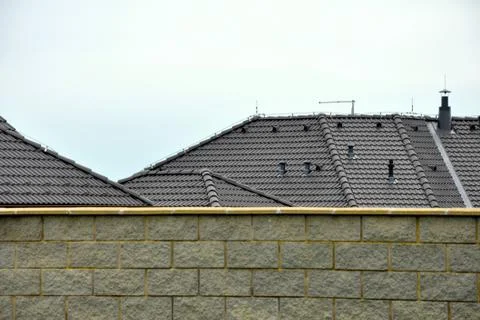 Roofs behind the wall Stock Photos
