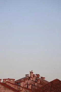 Roofs with chimneys Stock Photos
