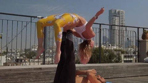 Rooftop AcroYoga session Stock Footage 118981114