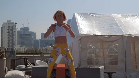 Rooftop AcroYoga session Stock Footage 118981799
