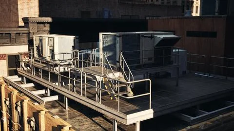 A rooftop air conditioner sitting on top of a building Ilustración de archivo