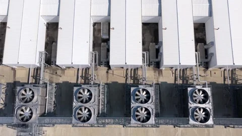 Rooftop Chiller Units Above a Data Center From Above Stock Footage 347279723