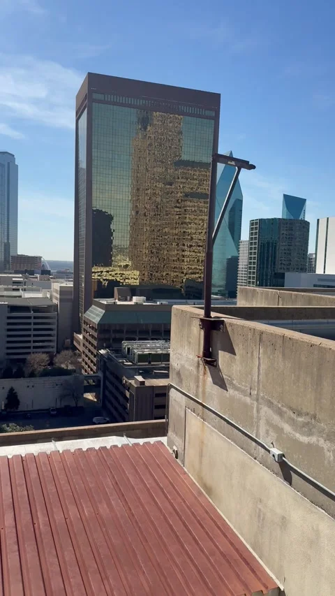 Rooftop City View with Glass Tower and Red Roof Stock Footage 344593568