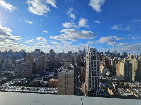 Rooftop city view under blue sky, no people Stock Photos