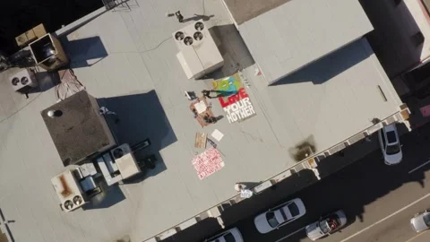 Rooftop Climate Protest Banner Painters From Direct Overhead Stock Footage 345397381