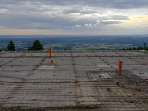Rooftop construction grid with distant countryside view Stock Photos