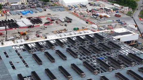 Rooftop cooling units go in by the row at a data center under construction in Stock Footage 345728060