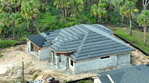 Rooftop covered with asphalt underlayment layer ready for installation of Stock Footage 257998426