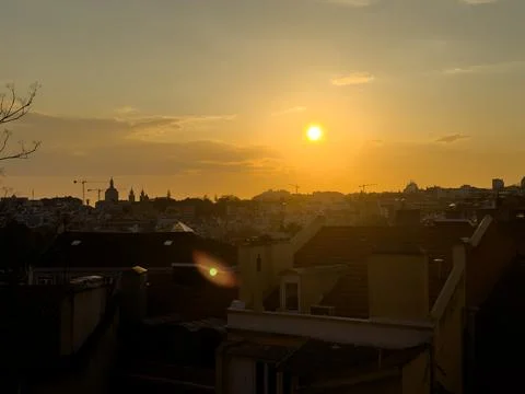 Rooftop empty brick floor with panoramic city skyline during sunset. Stock Photos
