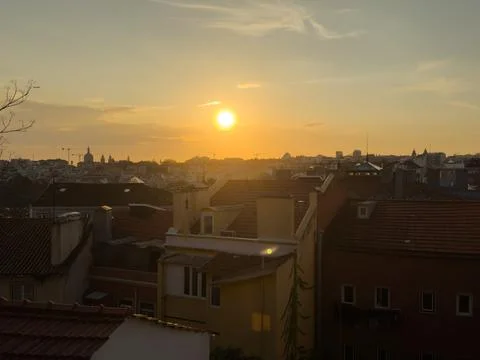 Rooftop empty brick floor with panoramic city skyline during sunset. Stock Photos