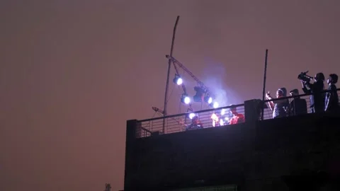 Rooftop fire breathers in Old Dhaka Stock Footage 152879728