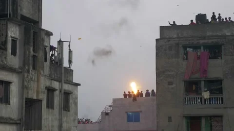 Rooftop fire breathers in Old Dhaka Stock Footage 152879741
