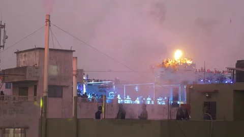 Rooftop fire breathers in Old Dhaka Stock Footage 152879755