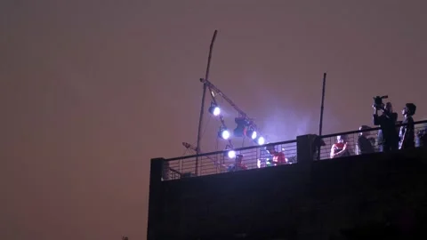 Rooftop fire breathers in Old Dhaka Stock Footage 152879782