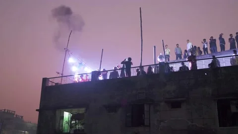 Rooftop fire breathers in Old Dhaka Stock Footage 152879912