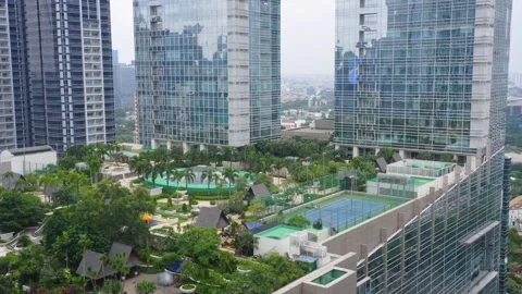 Rooftop Garden Between Skyscraper Buildings. Revealing Drone Shot. Jakarta - Stock Footage
