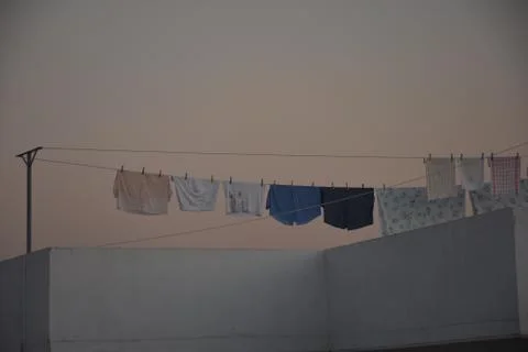 Rooftop hanging clothes Stock Photos