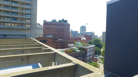 ROOFTOP HELICOPTER IN DISTANCE Video stock 104290658