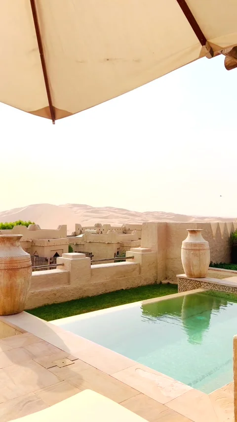 On rooftop of luxurious Arab-style building swimming pool with clear water is Stock-Footage 281208134