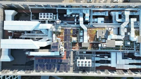 Rooftop of a modern energy-efficient office featuring ventilation systems and Stock Footage 335890496