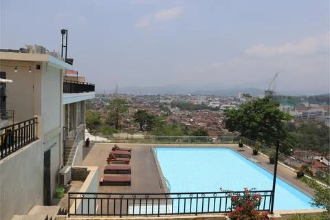 Rooftop Pool with Cityscape View on a Sunny Day Stock Photos