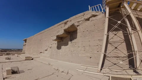 Rooftop Side wall of temple at Dendera complex with scaffolding and reliefs Stock Footage 309755081