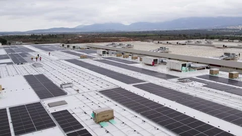 Rooftop solar installation workers downward orbit aerial Stock Footage 331241495