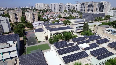 Rooftop Solar Panel Array with Urban Construction and Cityscape in Kiryat Ono Stock-Footage 335019925