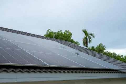 Rooftop solar panel installation technology in urban residential areas for .. Fotos de archivo