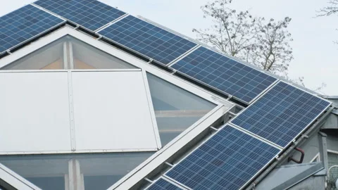 Rooftop solar panels on home in Germany. Unusual shape of the roof. Stock Footage 266066199