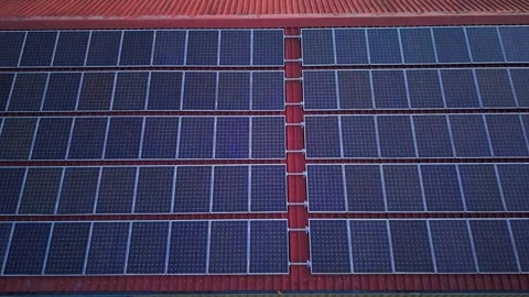 Rooftop solar panels, lateral drone pan Stock Footage 340921512