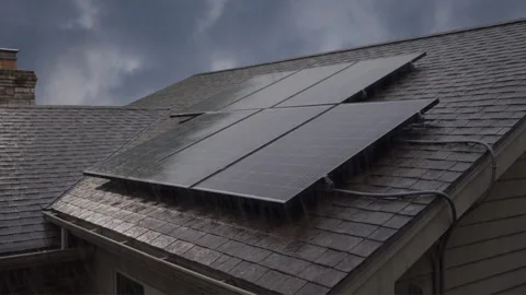 Rooftop solar panels in the rain Stock Footage 346106547
