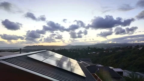 Rooftop solar panels reflecting the sunset sky Stock Footage 330026403