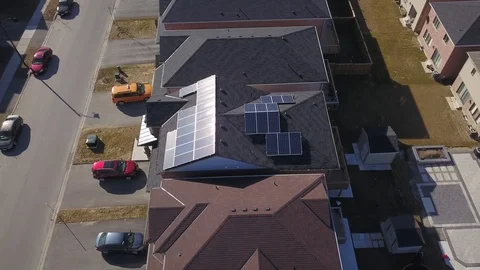 Rooftop solar panels in suburb from drone Stock Footage 105207514